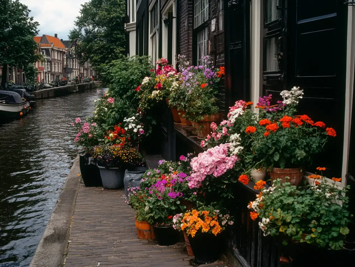 Serene canal lined with various potted plants reflecting on the water, in a tranquil, idyllic setting.