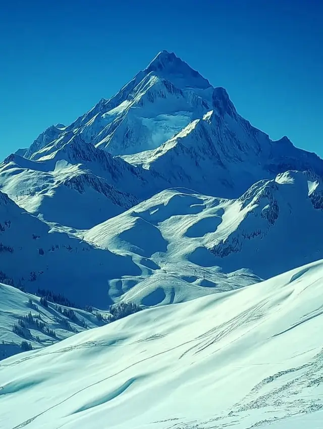 Mountains with snow under sunny weather.