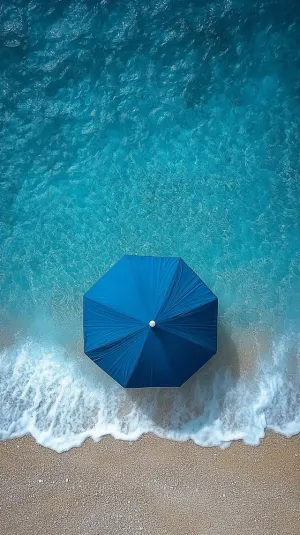 Aerial View of a Lonely Beach Umbrella